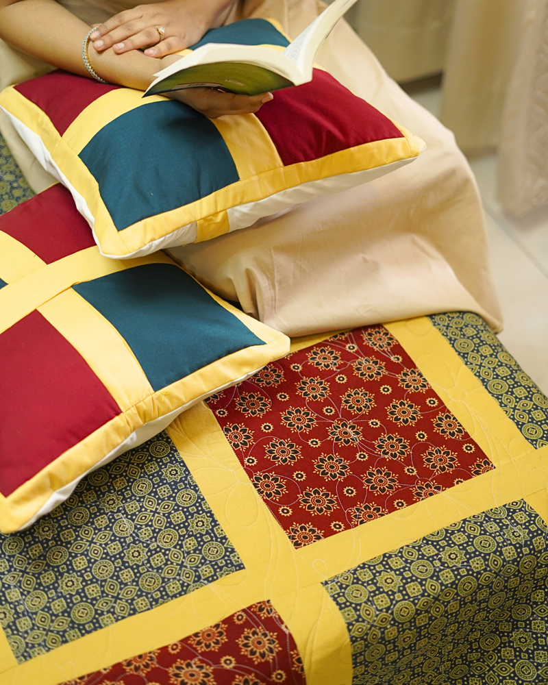 lifestyle image featuring a tray with flowers and tea on the corner of the bedspread, illustrating the cozy and luxurious room aesthetic.