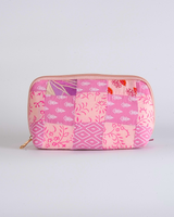 A front-facing studio shot of the Blush Pink & Rose Quilted Pouch, showcasing the delicate floral and diamond patchwork in varying shades of pink.
