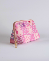 A straightforward horizontal view against a white background, highlighting the balanced distribution of the pink textile blocks and the clean quilted finish.