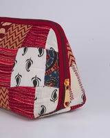 An angled perspective from above, emphasizing the detailed chevron pattern and the secure, crimson-toned zipper hardware.