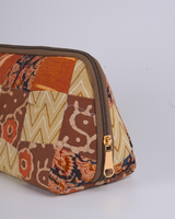 A side profile view showing the pouch’s wide-bottom, triangular structure that allows it to stand upright independently on a flat surface.