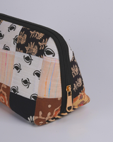 A side profile view showing the pouch’s wide-bottom, triangular structure that allows it to stand upright independently.