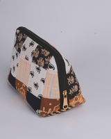 An angled perspective from above, emphasizing the detailed leaf prints and the high-quality, hand-quilted texture of the material.