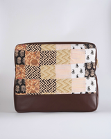 A front-facing view of the laptop bag, highlighting the elegant mix of floral and geometric quilted patterns.