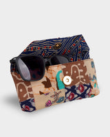 A view of the case partially open with a pair of dark sunglasses inside, demonstrating the secure internal compartment and protective lining.