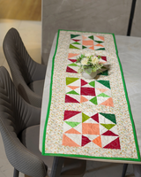 A wide view of the dining table, showing the impressive 80" length of the runner as it covers the center of the table.